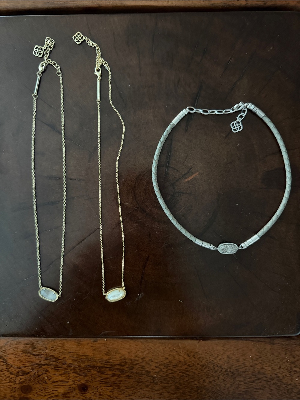 Kendra Scott Gold Necklaces. One Gray Stone, one MotherofPearl, leather choker.
